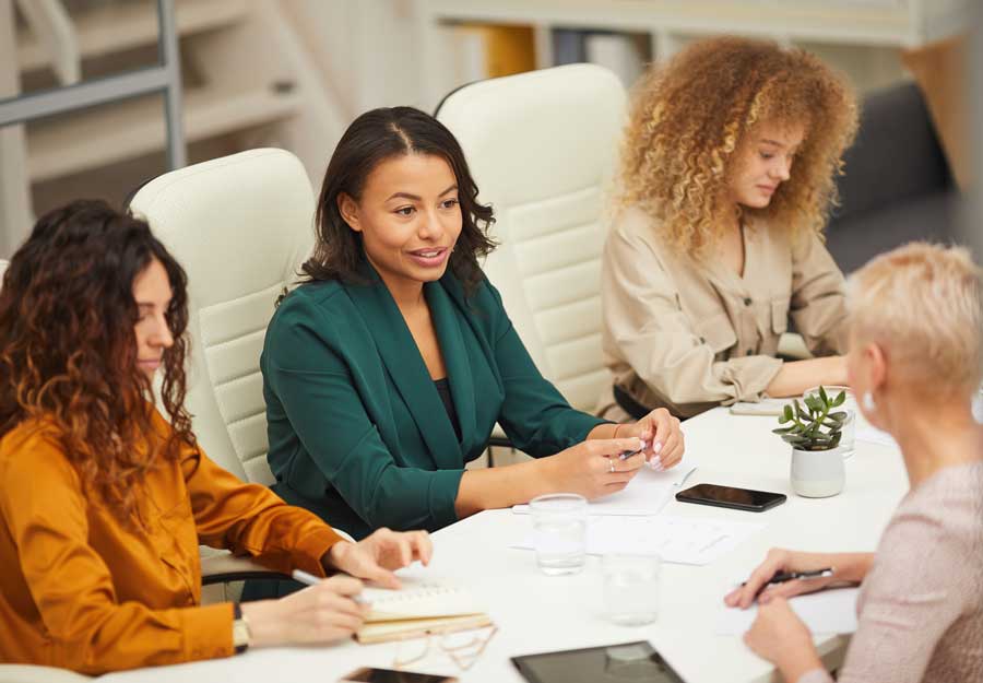 women sitting at a conference table